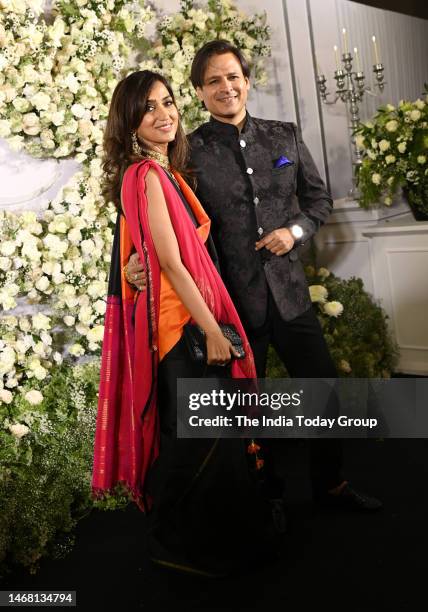 Mumbai, India Bollywood actor Vivek Oberoi and his wife Priyanka Alva pose during the wedding reception party of actors Sidharth Malhotra and Kiara...