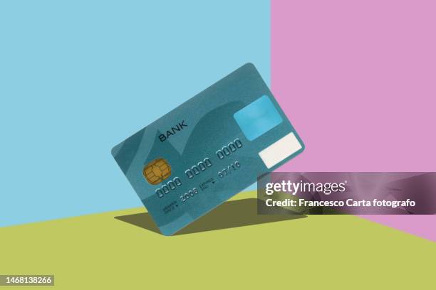 credit card floating - charging fotografías e imágenes de stock