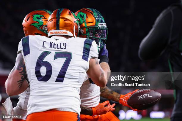 Josh Gordon of the Seattle Sea Dragons celebrates with teammates after catching a pass for a touchdown against the DC Defenders during the first half...