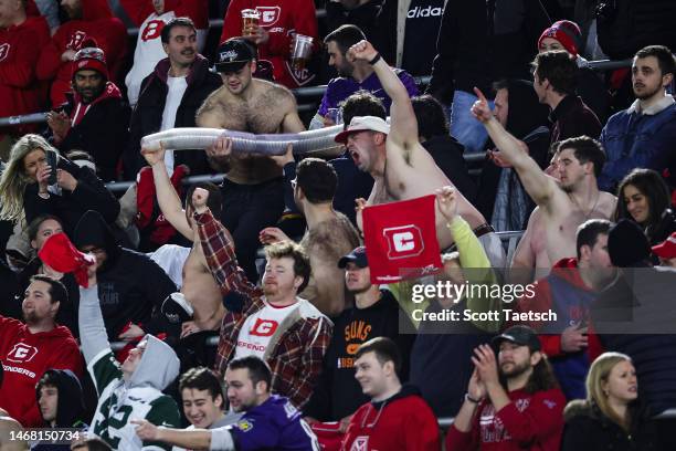 Fans rebuild a beer cup snake during the second half of the XFL game between the DC Defenders and the Seattle Sea Dragons at Audi Field on February...