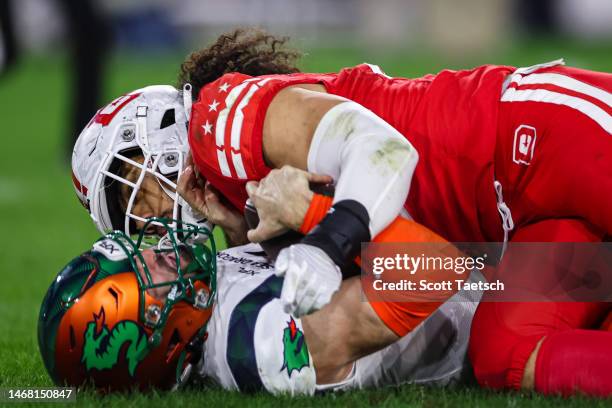 Ben DiNucci of the Seattle Sea Dragons is sacked by Francis Bernard of the DC Defenders during the second half of the XFL game at Audi Field on...