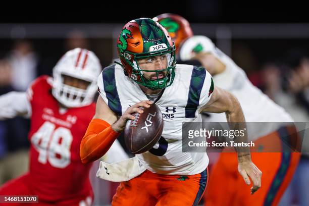 Ben DiNucci of the Seattle Sea Dragons scrambles against the DC Defenders during the second half of the XFL game at Audi Field on February 19, 2023...