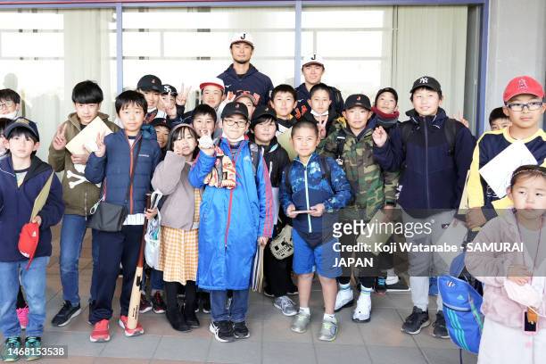 Yu Darvish and Yoshinobu Yamamoto of Samurai Japan pose with fans during a training session on February 21, 2023 in Miyazaki, Japan.