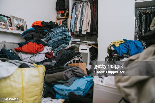 a messy bedroom during the change of wardrobe - clutter stock pictures, royalty-free photos & images