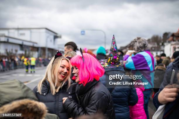 two womans waiting for carnival train. - fasching stock-fotos und bilder