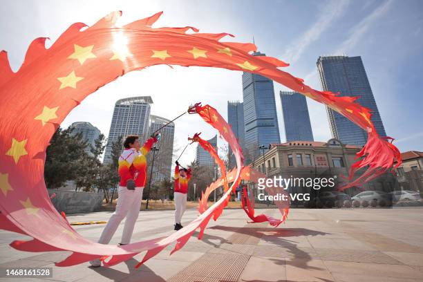 People perform dragon dance to celebrate the 'Er Yue Er' Festival, or Dragon-Head-Raising Festival, on February 21, 2023 in Yantai, Shandong Province...