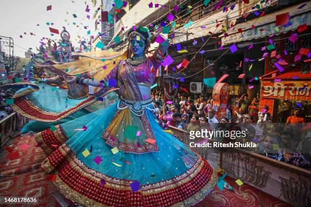 Artists dressed as different characters from Hindu mythology perform during a religious procession for the Maha Shivratri festival on February 18,...