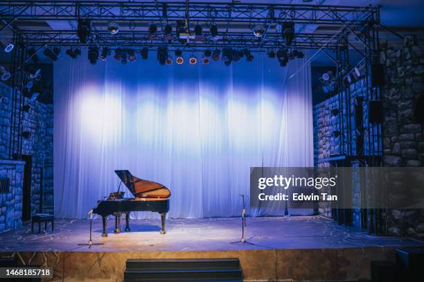 music stage theater with grand piano and white backdrop illuminated with stage light - concert background stock pictures, royalty-free photos & images