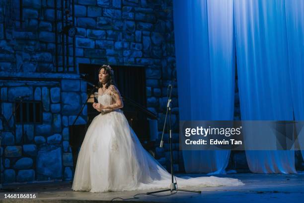 young chinese female opera singer performing solo on stage - soprano singer stock pictures, royalty-free photos & images