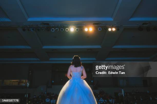 rear view young chinese female opera singer performing solo on stage - soprano singer stock pictures, royalty-free photos & images