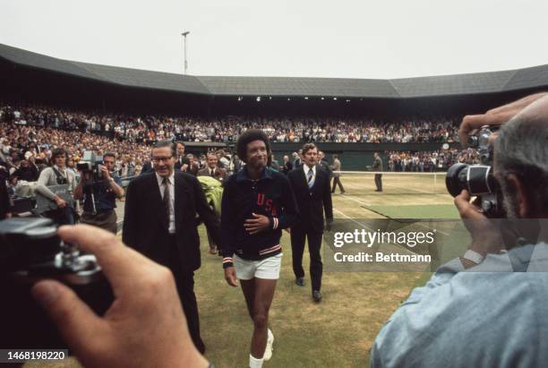 American tennis player Arthur Ashe leaving Centre Court after winning the men's singles of the Wimbledon Tennis Championship in London on July 5th,...