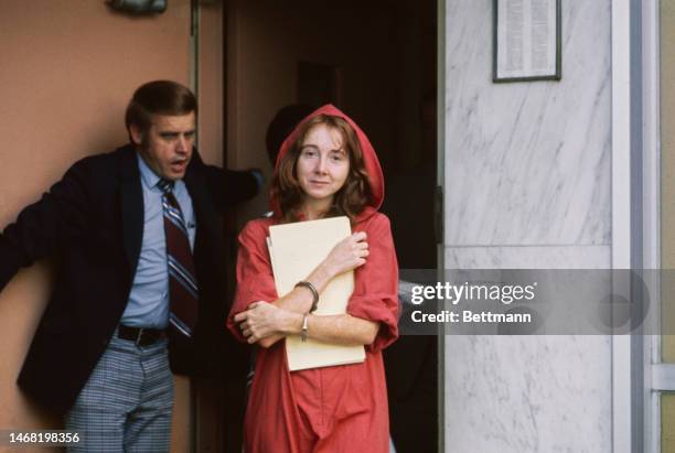 Lynette 'Squeaky' Fromme wears a red robe at the courthouse in Sacramento, California, after being charged with attempting to assassinate President...