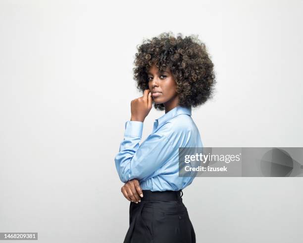 portrait of a confident young businesswoman - woman black shirt stock pictures, royalty-free photos & images