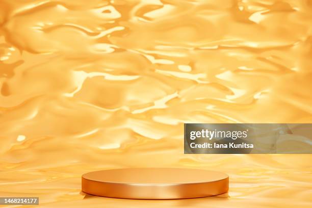 golden podium, platform for displaying products on transparent liquid yellow background. beauty 3d pattern. - orange creme stock pictures, royalty-free photos & images