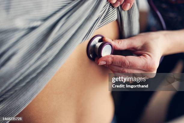 teenage boy having lungs auscultation examination at home - lunga bildbanksfoton och bilder