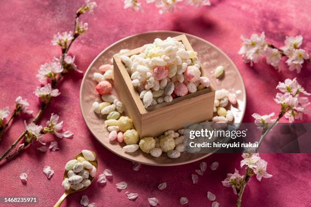 sweet rice crackers - hinamatsuri stock pictures, royalty-free photos & images