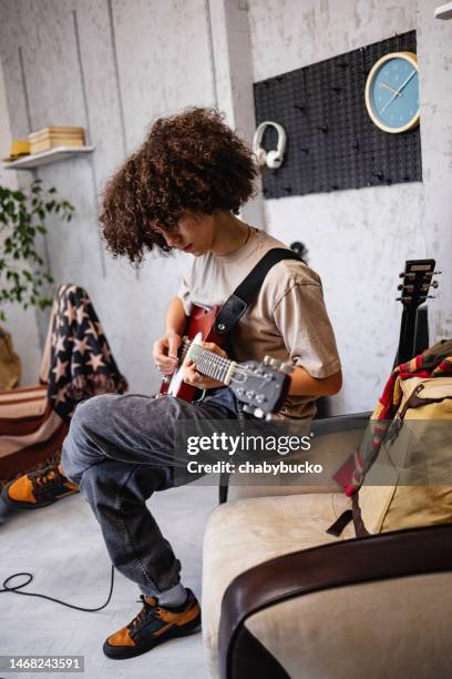 boy enjoys electric guitar play - recording studio room stock pictures, royalty-free photos & images