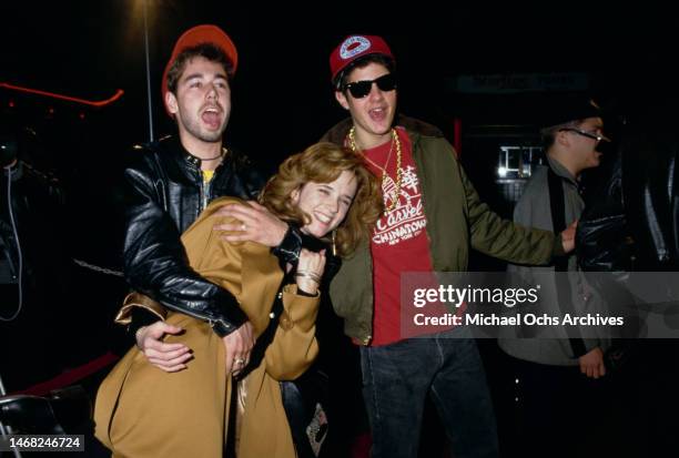 Musician Adam 'MCA' Yauch, actress Lea Thompson, and musician Michael 'Mike D' Diamond, attend the Los Angeles premiere of 'Some Kind of Wonderful',...