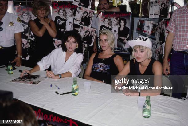 Bananarama; Keren Woodward, Sara Dallin, and Siobhan Fahey during an in-store signing for the band's album 'True Confessions' at a branch of...