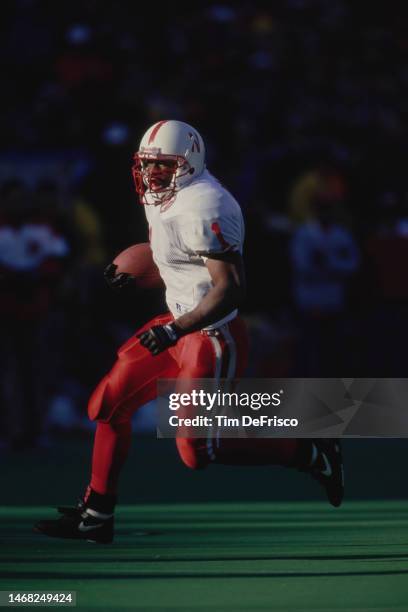 Lawrence Phillips, Running Back for the University of Nebraska Cornhuskers in motion running the football during the NCAA Big 8 Conference college...