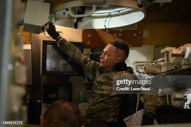 Ukrainian volunteer recruits run through procedures in a Van Halteren Technologies AS90 155mm self-propelled artillery system simulator during...