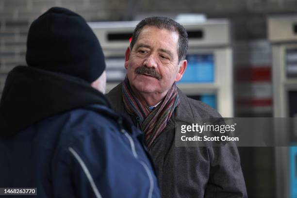 Chicago mayoral candidate Congressman Jesus "Chuy" Garcia greets commuters at an 'L' station during an early-morning campaign stop in the Pilsen...