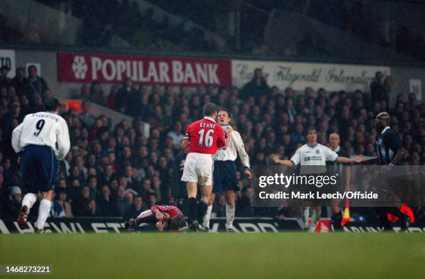 December 1998, London - FA Carling Premiership - Tottenham Hotspur v Manchester United - Roy Keane of Man Utd angrily grabs Andy Sinton of Tottenham...