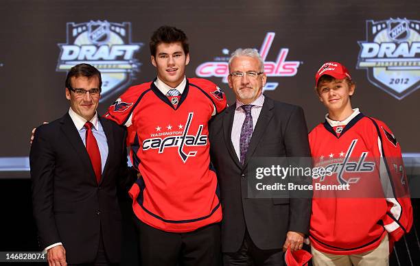 Thomas Wilson , 16th overall pick by the Washington Capitals, poses on stage with Capitals representatives during Round One of the 2012 NHL Entry...