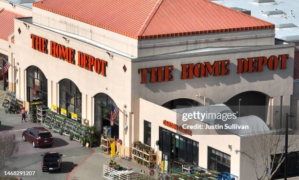 In an aerial view, a sign is seen posted on the exterior of a Home Depot store on February 21, 2023 in El Cerrito, California. Home improvement...