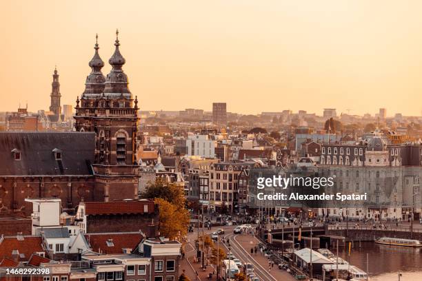 amsterdam skyline at sunset, aerial view, netherlands - amsterdam aerial stock pictures, royalty-free photos & images