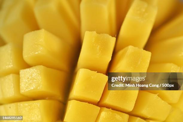 full frame shot of chopped mango,france - mangue photos et images de collection