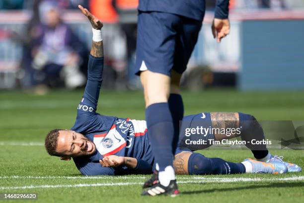 Neymar of Paris Saint-Germain writhes in pain with an ankle injury after a challenge with Benjamin André of Lille which resulted in Neymar leaving...
