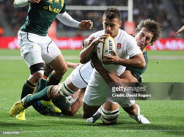 Danny Care of England dives over for the first try during the third test match between the South Africa Springboks and England at the Nelson Mandela...