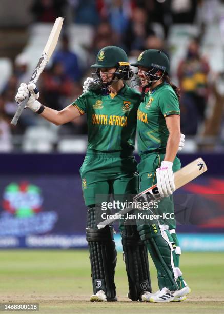 Laura Wolvaardt of South Africa celebrates their half century with team mate Tamzin Brits during the ICC Women's T20 World Cup group A match between...