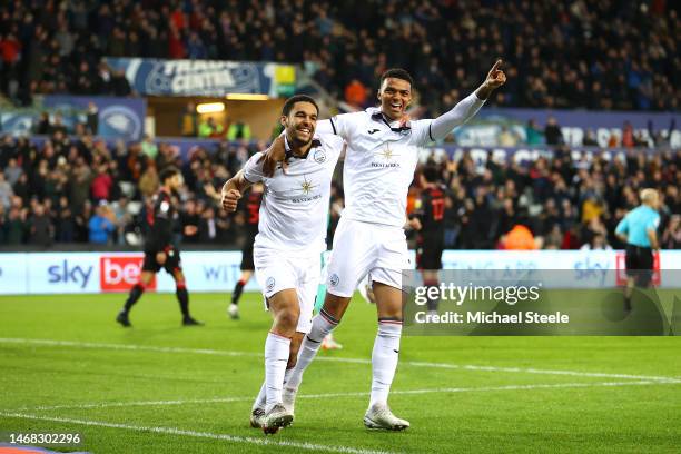 Morgan Whittaker of Swansea City celebrates after scoring the team's first goal with teammate Ben Cabango during the Sky Bet Championship match...