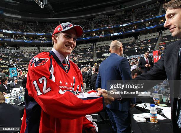 Thomas Dipauli, 100th overall pick, walks on the draft floor during day two of the 2012 NHL Entry Draft at Consol Energy Center on June 23, 2012 in...