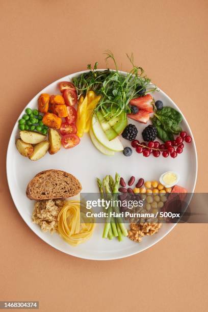 healthy food ingredients on a ceramic plate,indonesia - serving size stock pictures, royalty-free photos & images