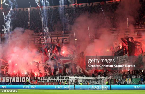 Eintracht Frankfurt fans show their support with banners and flares prior to the UEFA Champions League round of 16 leg one match between Eintracht...