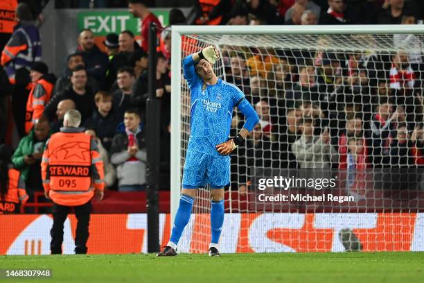 Thibaut Courtois of Real Madrid looks dejected after Mohamed Salah of Liverpool scores the team's second goal during the UEFA Champions League round...