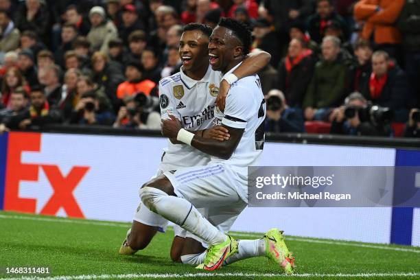 Vinicius Junior of Real Madrid celebrates after scoring the team's second goal with teammate Rodrygo during the UEFA Champions League round of 16 leg...