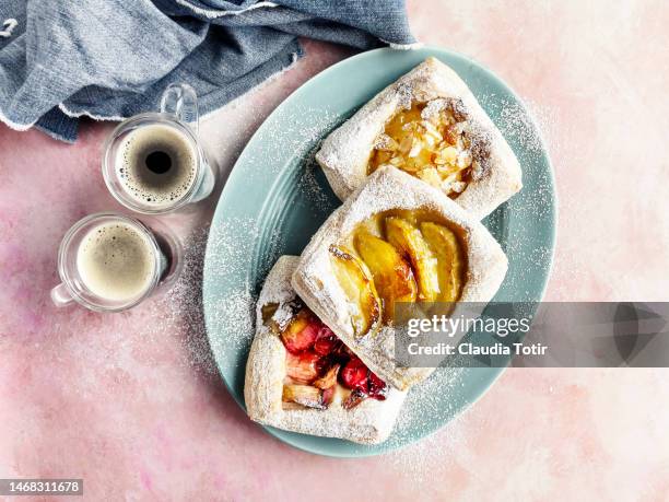 assorted danish pastry,  and two shots of espresso on pink background - breakfast pastries stock pictures, royalty-free photos & images