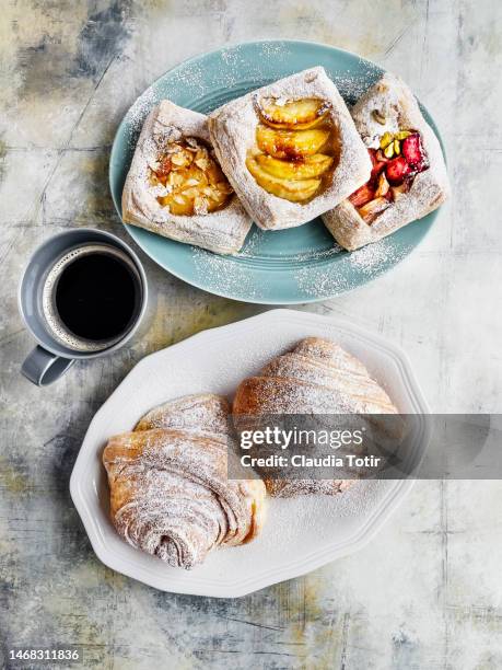 assorted danish pastry, and croissants with a cup of coffee on multicolored background - breakfast pastries stock pictures, royalty-free photos & images