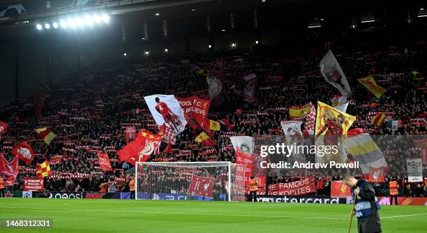 Fans of Liverpool holding banners and flags in the Kop stand before the UEFA Champions League round of 16 leg one match between Liverpool FC and Real...