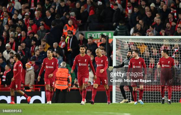 Players of Liverpool looks dejected after Karim Benzema of Real Madrid scores their side's fourth goal during the UEFA Champions League round of 16...