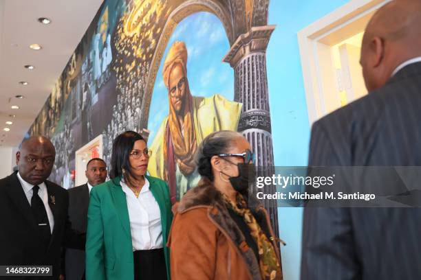 The daughters of Malcolm X, Ilyasah Shabazz and Qubilah Shabazz, are led out after a press conference at the Malcolm X & Dr. Betty Shabazz Memorial...