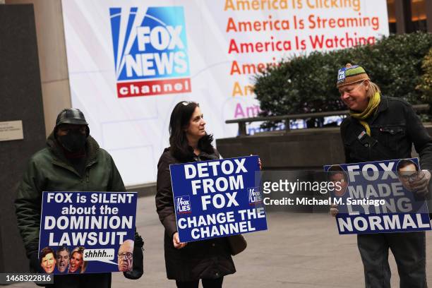 Members of Rise and Resist participate in their weekly "Truth Tuesday" protest at News Corp headquarters on February 21, 2023 in New York City. Text...