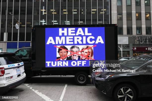 Video truck displays a message as members of Rise and Resist participate in their weekly "Truth Tuesday" protest at News Corp headquarters on...