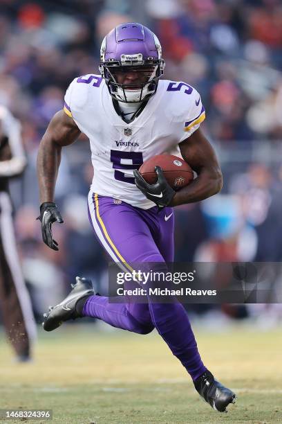 Jalen Reagor of the Minnesota Vikings runs with the ball after a reception against the Chicago Bears at Soldier Field on January 08, 2023 in Chicago,...