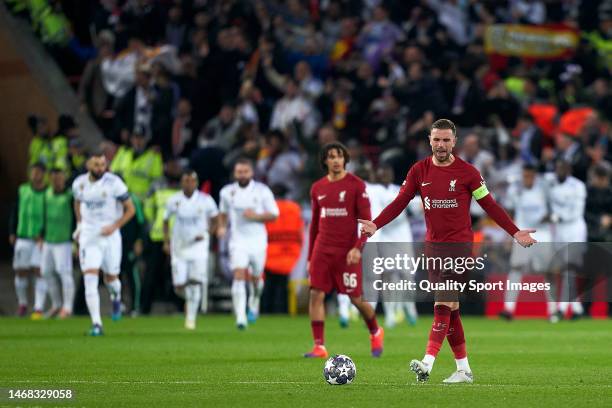 Jordan Henderson of Liverpool FC reacts after Karim Benzema of Real Madrid scored his team fourth goal during the UEFA Champions League round of 16...