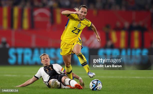 Alexandra Popp of Germany challenges Elin Rubensson of Sweden during the Women's friendly match between Germany and Sweden at...
